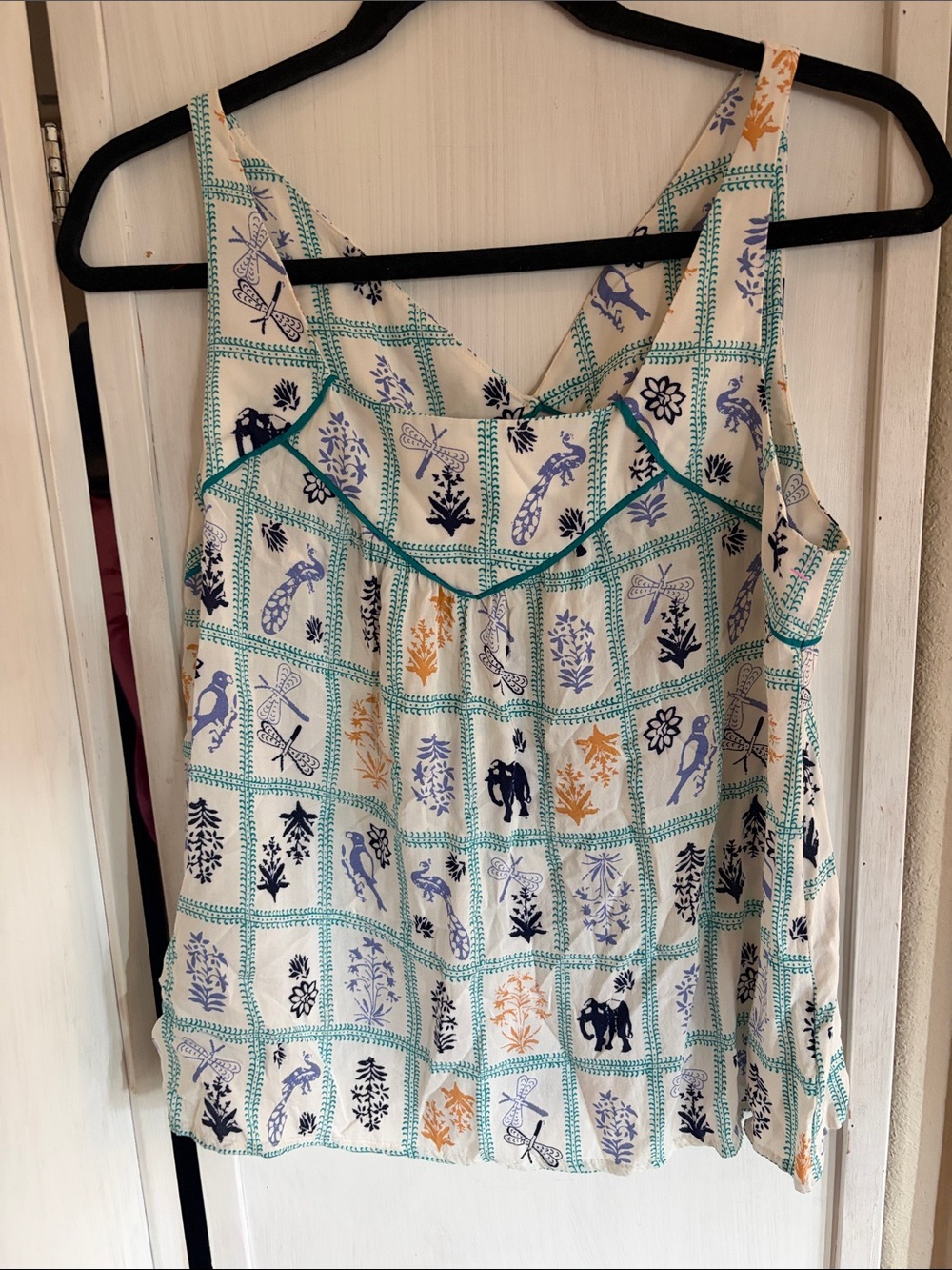 Adorable Marge Sleeveless Printed White Tank Top with Blue & Orange animal Motif